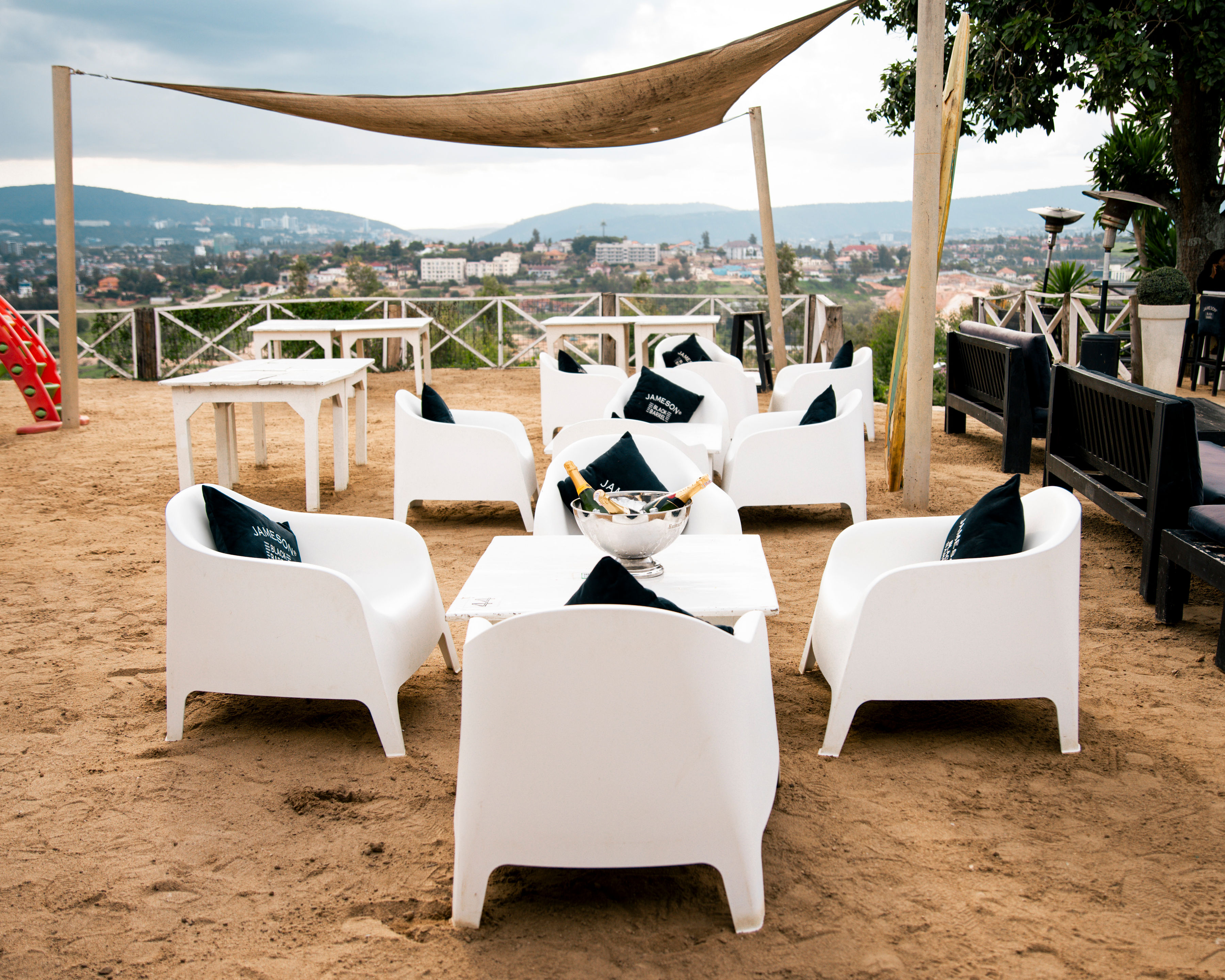 Pili Pili Kigali - Luxury boutique hotel featuring wooden decks, stone-baked pizza, and Kigali's best sunset views